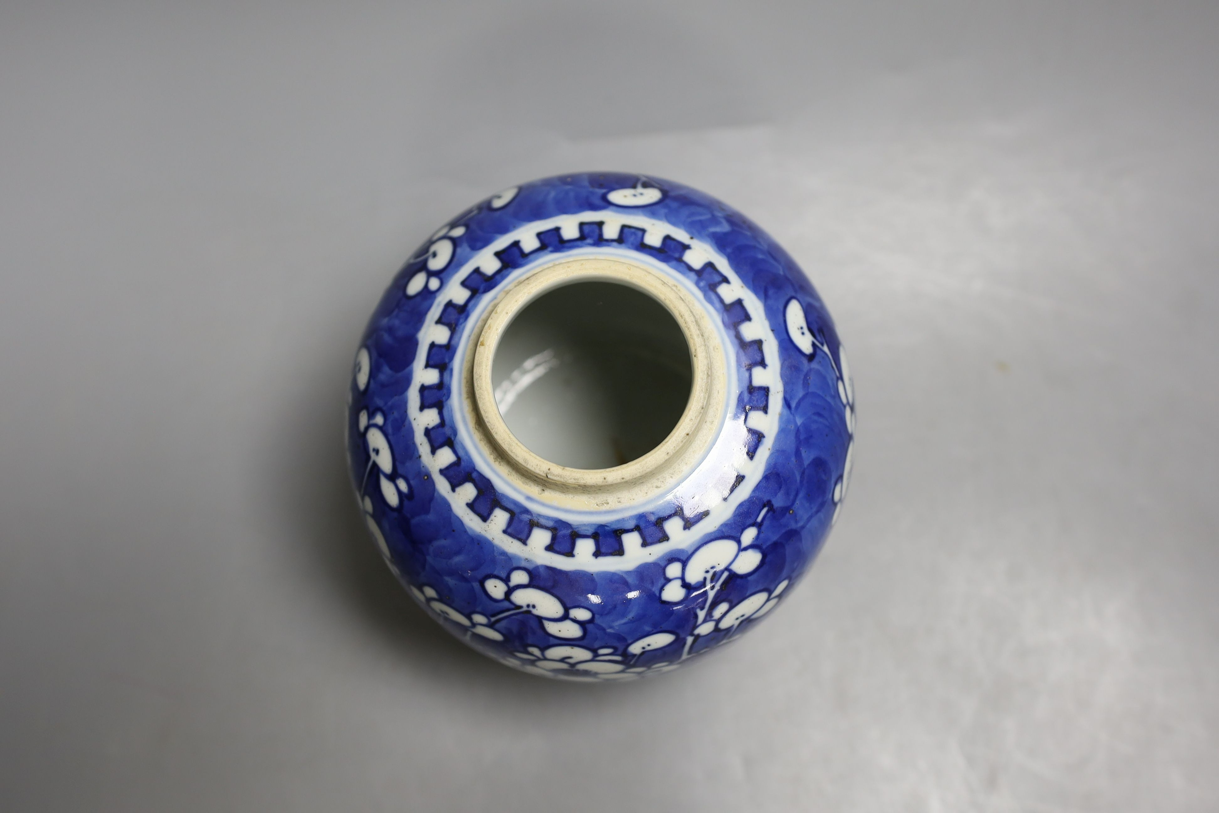 A Chinese blue and white jar and cover, Kangxi mark and of the period, 15cm tall